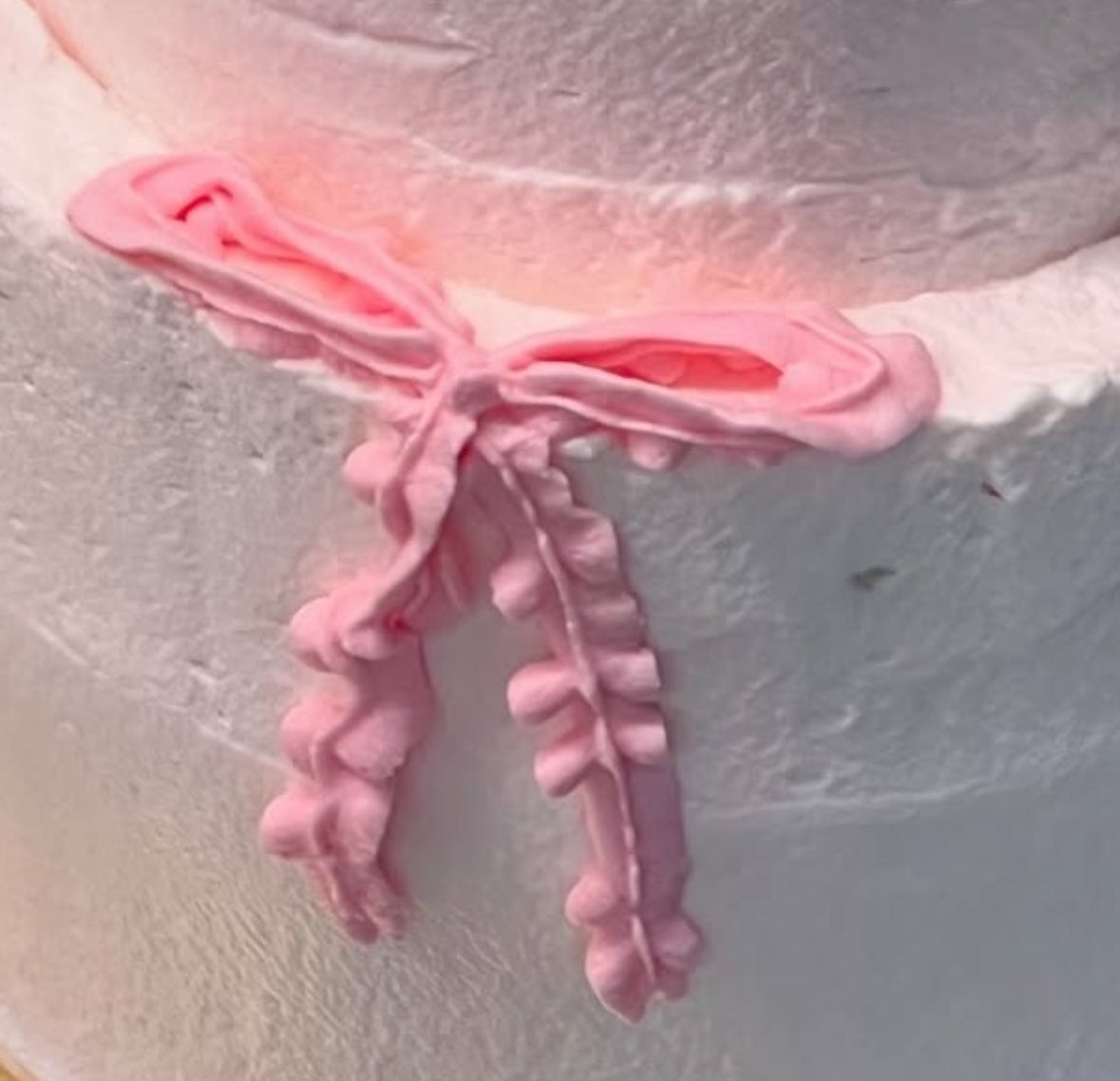 FROSTED BOW ANGEL CAKE