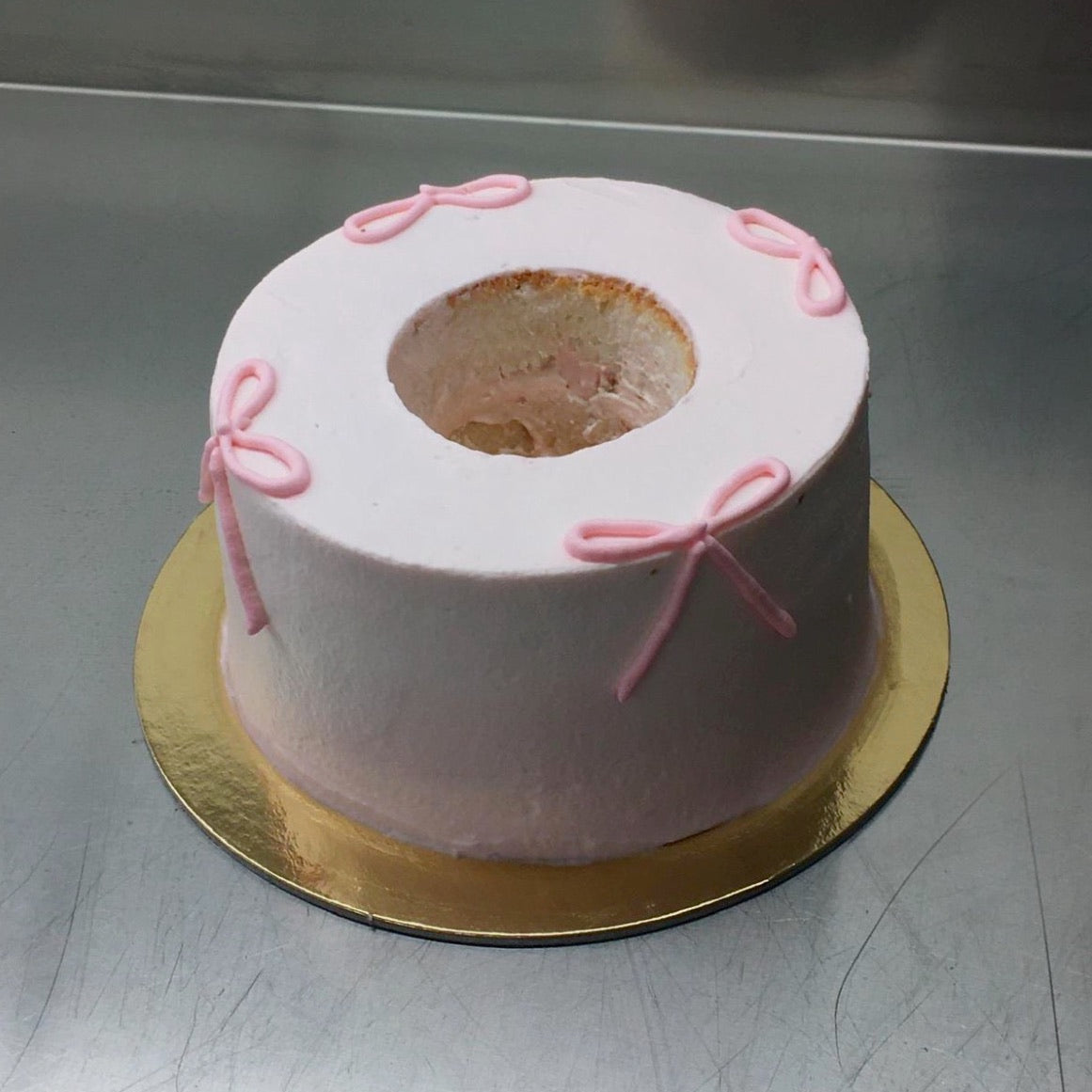 FROSTED BOW ANGEL CAKE